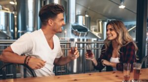 Young couple drinking alcohol in a bar